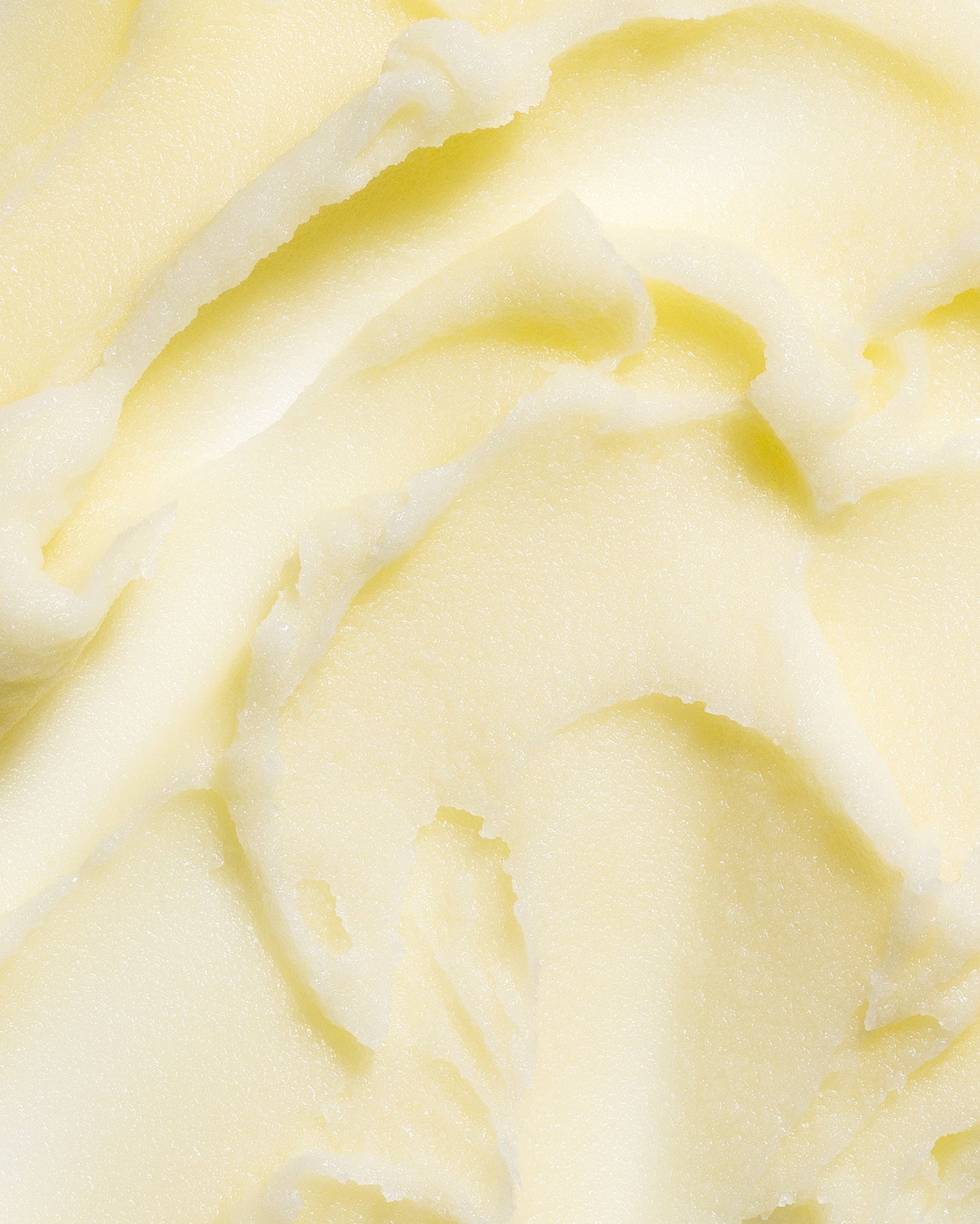 Thick tallow balm texture, creamy pale yellow swirls.