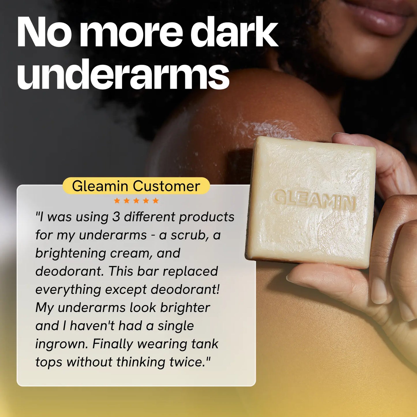 Cleansing bar near underarm, square pale yellow soap with GLEAMIN imprint