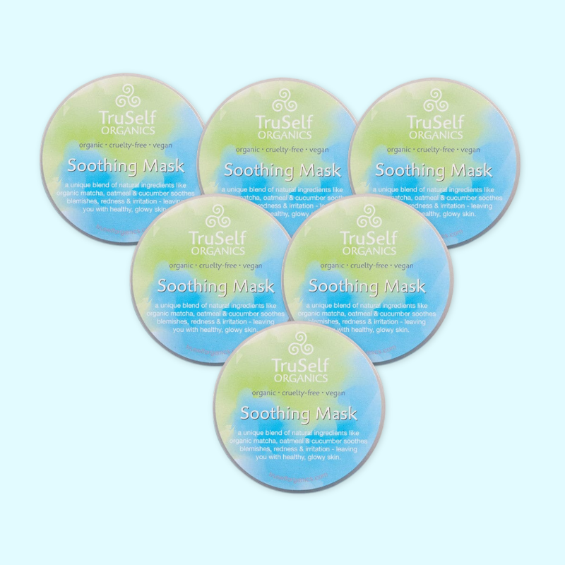 Six Soothing face mask jars with green-blue Soothing Mask labels arranged together