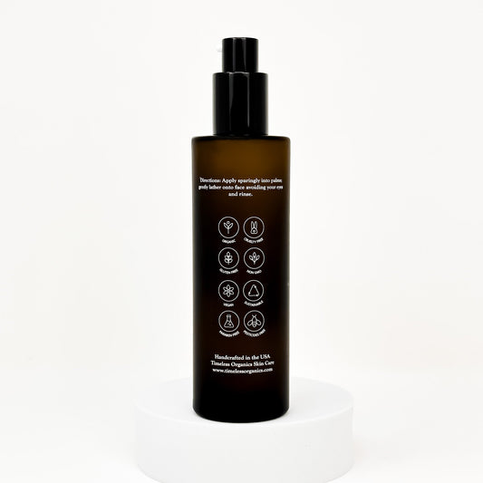 Clarifying acne gel cleanser bottle back label with icons and usage text, black pump