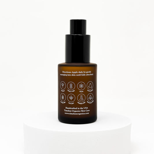 Glow serum bottle with black pump, brown glass, back label side facing camera.