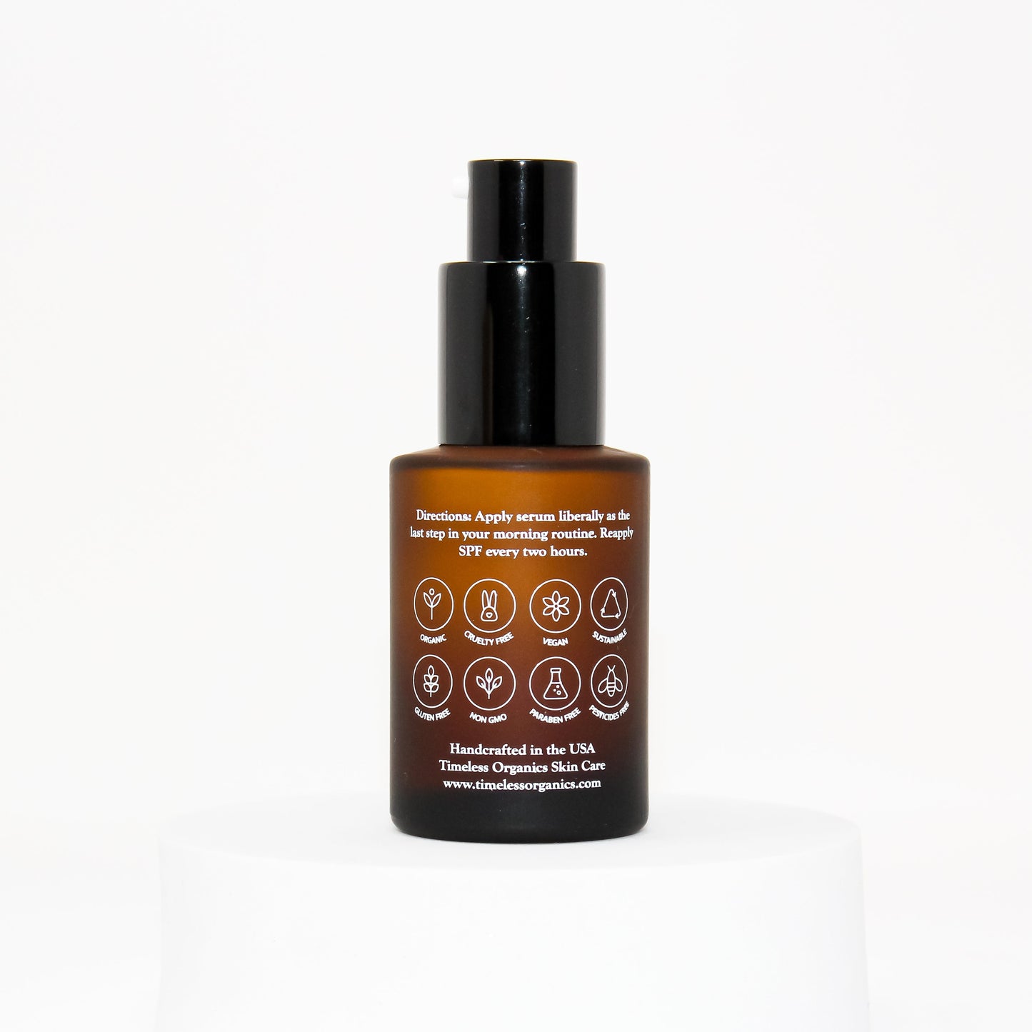 Sun defense serum SPF 30 bottle with black pump; amber glass back label.