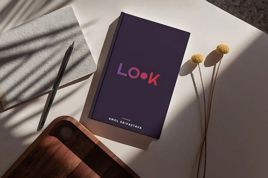 A book with the word look on a table.