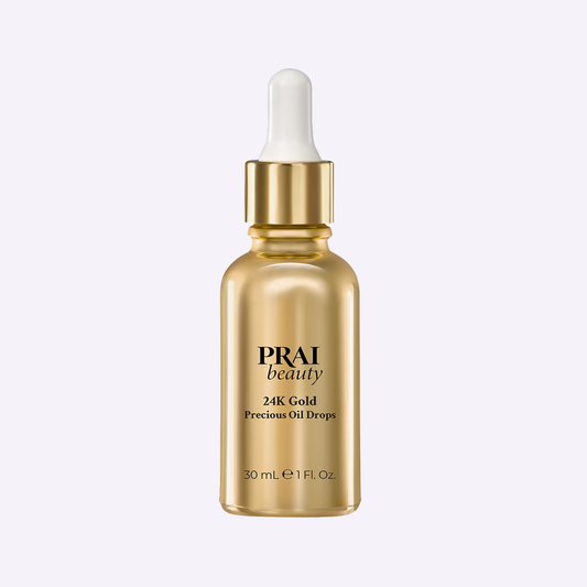 24K gold precious oil drops facial oil bottle with PRAI beauty label, 30 mL