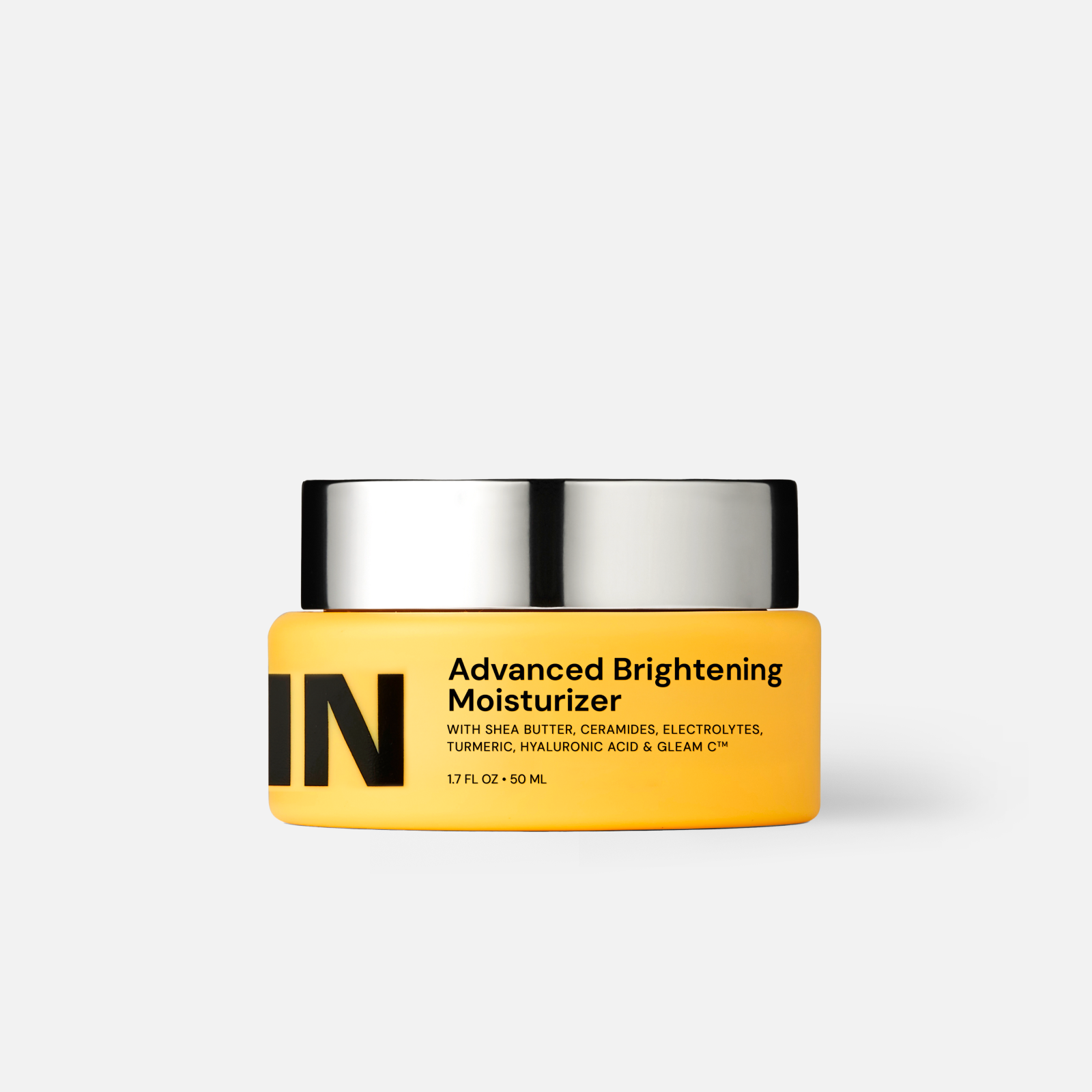 Brightening face moisturizer jar with yellow body and silver lid, 50 mL