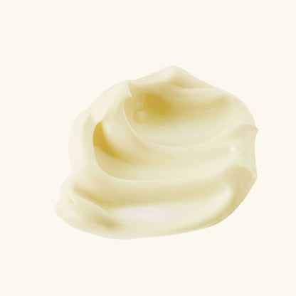 Thick, pale yellow face moisturizer cream dollop on a scoop