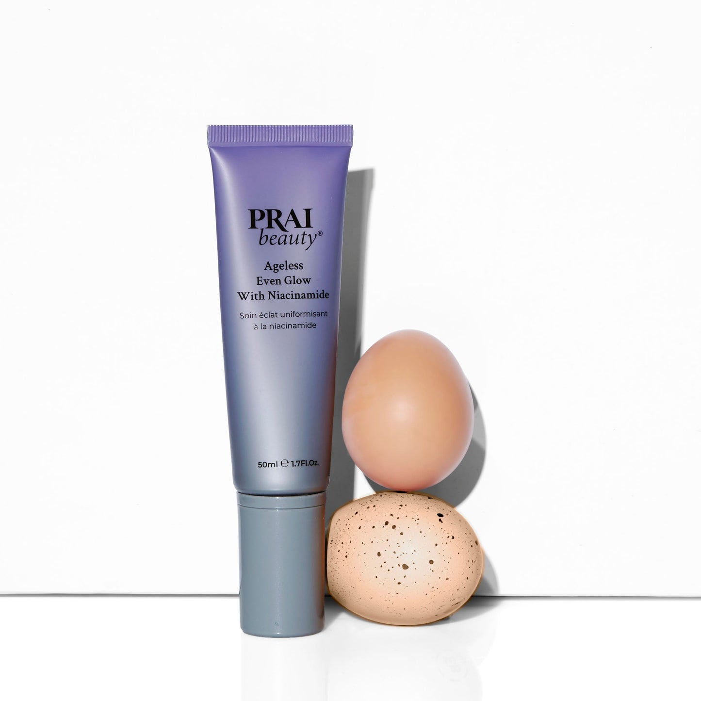 PRAI beauty Ageless Even Glow serum tube with niacinamide, upright view