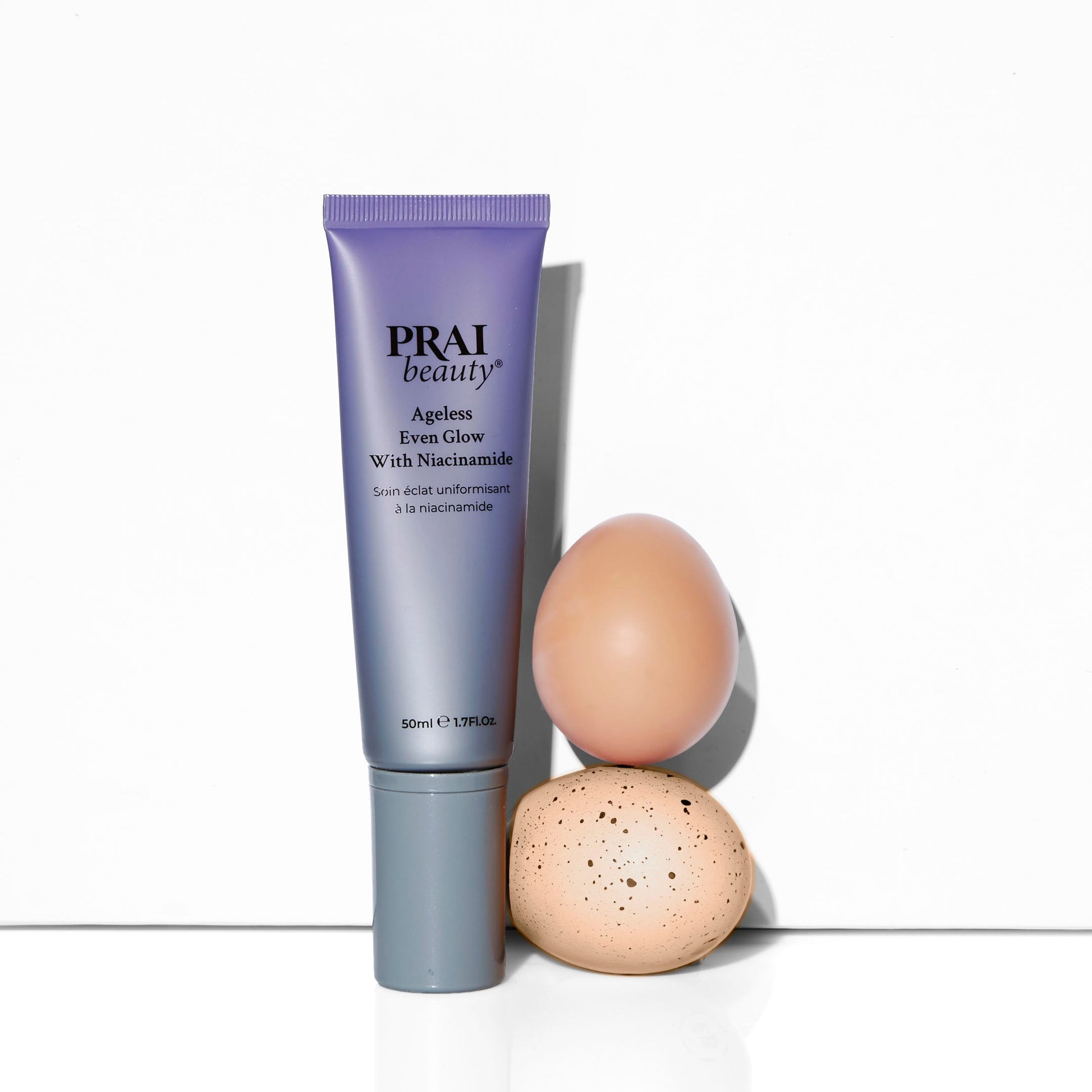 PRAI beauty Ageless Even Glow serum tube with niacinamide, upright view