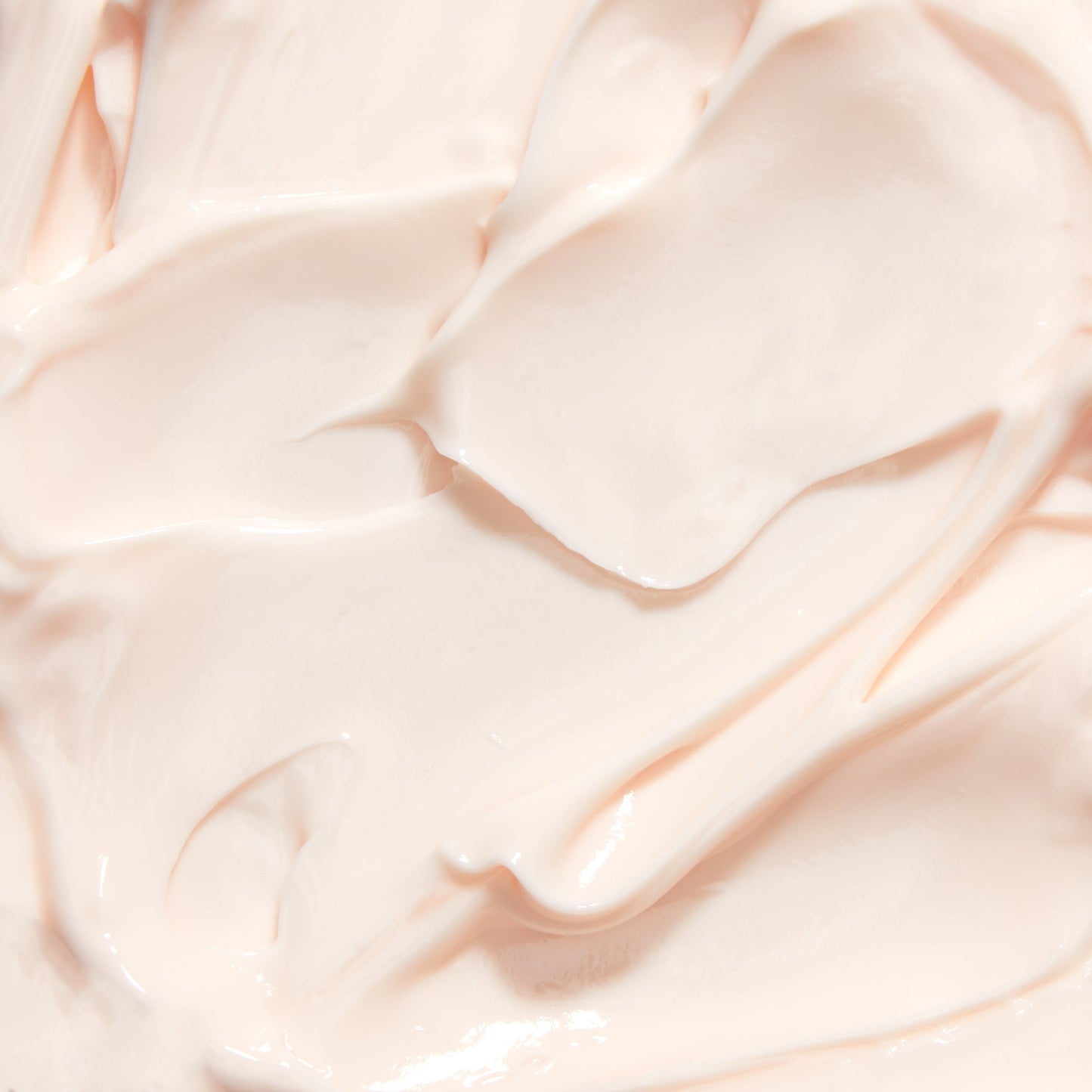 Cream texture scoop with smooth, glossy off-white night creme