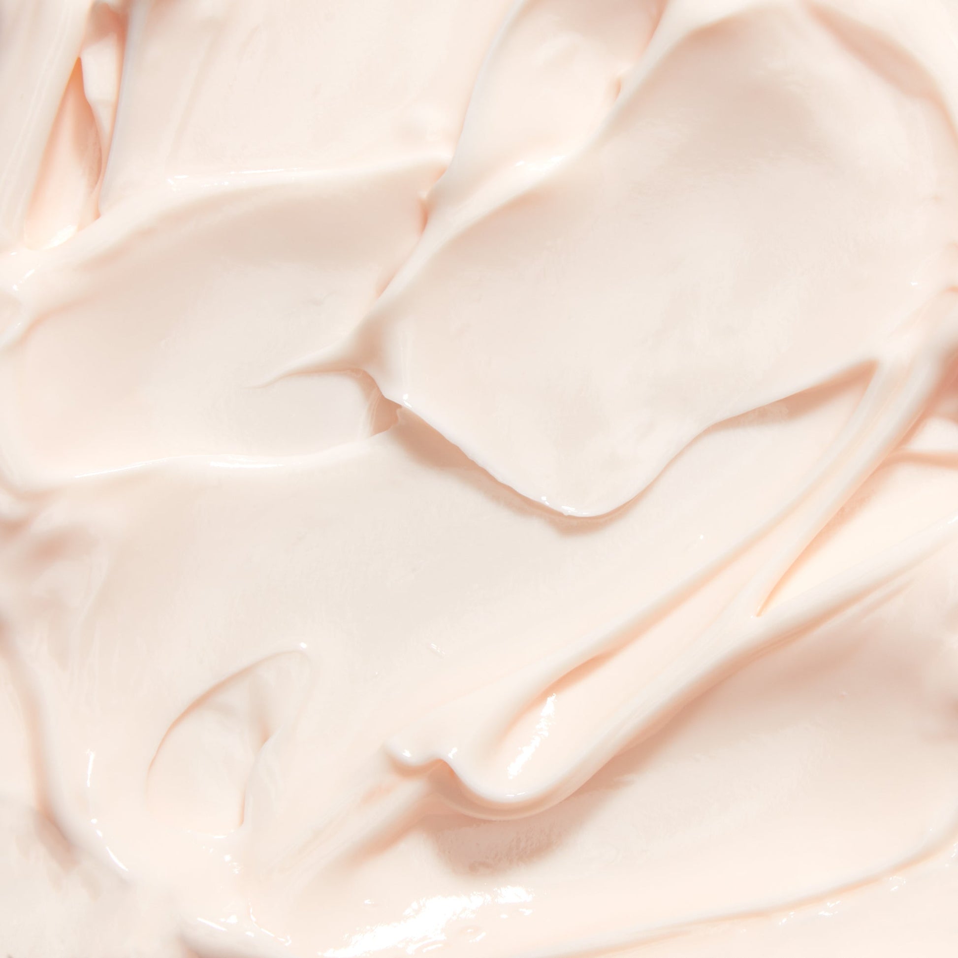 Cream texture scoop with smooth, glossy off-white night creme