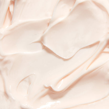 Cream texture scoop with smooth, glossy off-white night creme