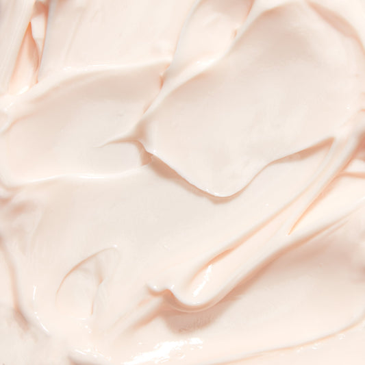 Cream texture scoop with smooth, glossy off-white night creme