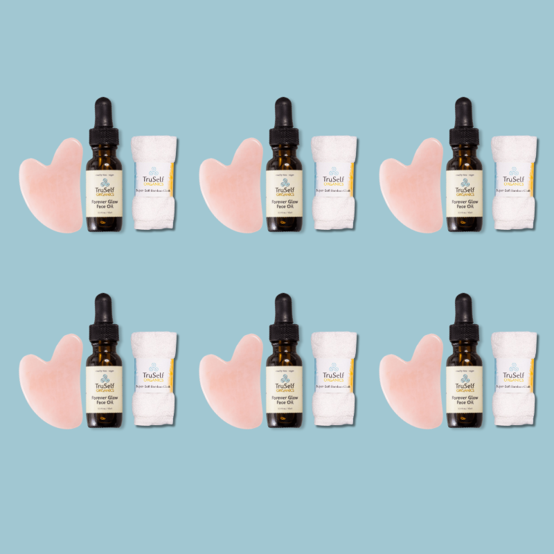 Anti-aging facial massage kit shown in rows: rose quartz gua sha, face oil bottle, bamboo cloth
