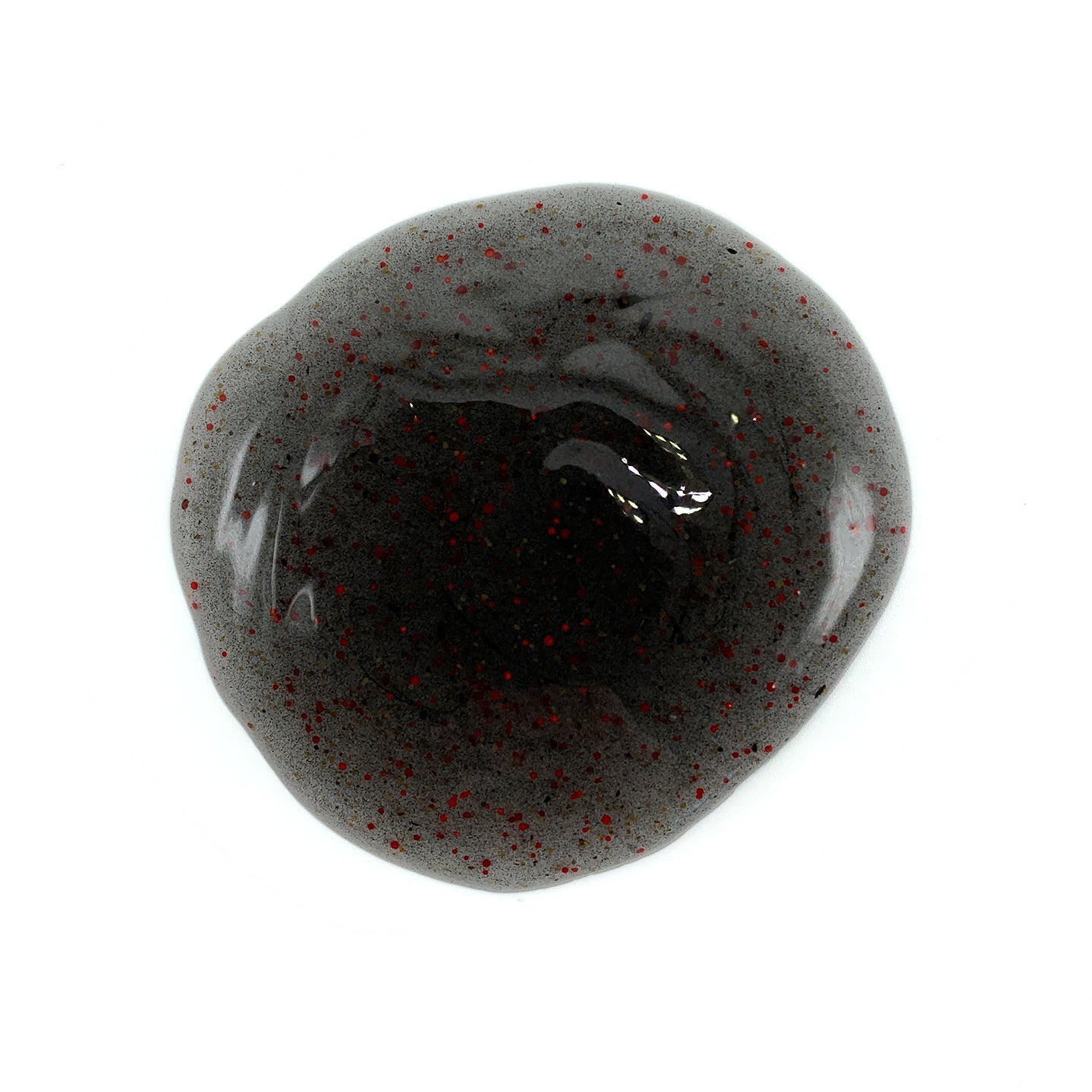 Dark body wash gel with red speckles in a swirl