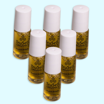 TruSelf ORGANICS blemish remedy spot treatment set of six bottles with white caps.