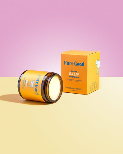 Tallow balm jar with open label and orange Pure Good carton, cedarwood & patchouli
