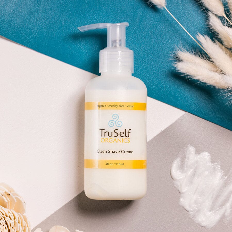 Clean Shave Creme pump bottle with white body and orange-banded label