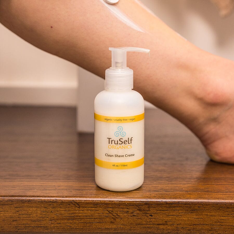 Clean Shave Creme pump bottle with clear dispenser and orange-banded label