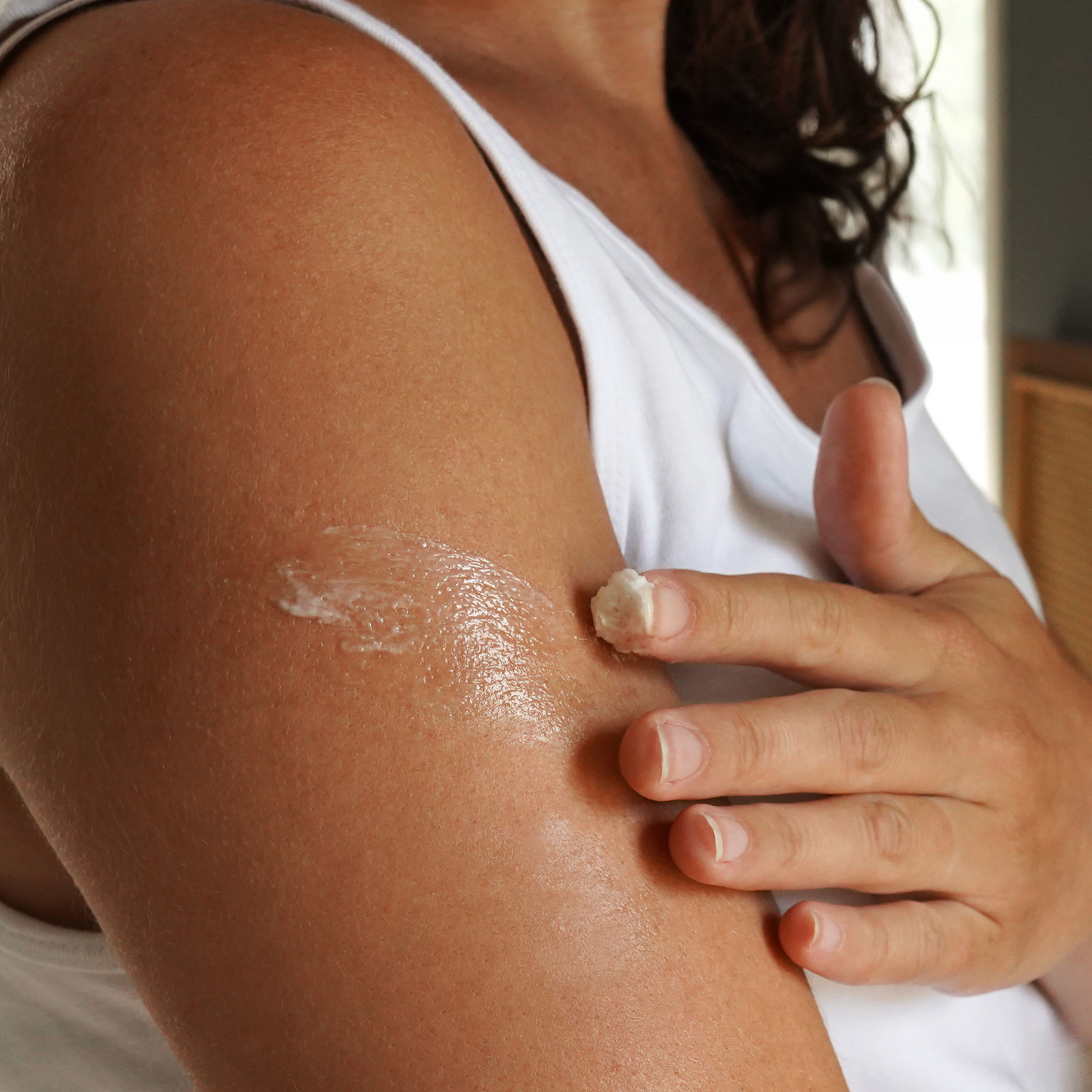 Whipped tallow & magnesium balm being smoothed onto leg skin