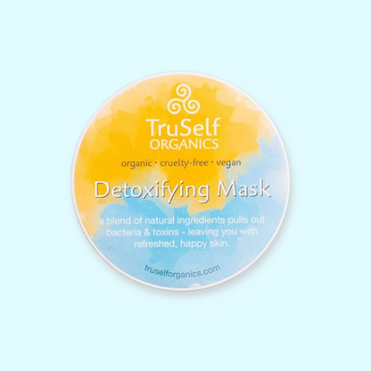 Detoxifying mask jar lid with TruSelf Organics yellow-blue label and Detoxifying Mask text