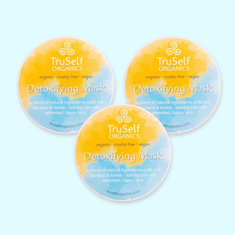 Set of three detoxifying mask jar lids with TruSelf Organics yellow-blue labels