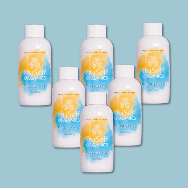 Detoxifying solution bottles set of six, white with orange-blue swirl labels and ribbed caps