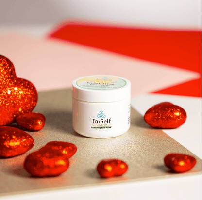 Exfoliating face polish jar with open lid, white container and beige scrub