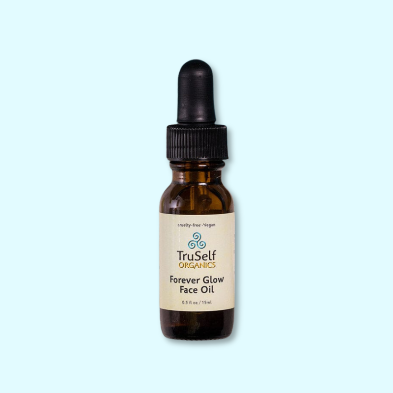 Forever Glow face oil bottle with black dropper and tan label