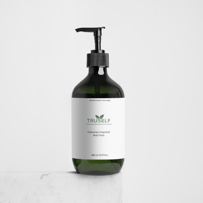 Body wash bottle with black pump, dark green bottle, white grapefruit label