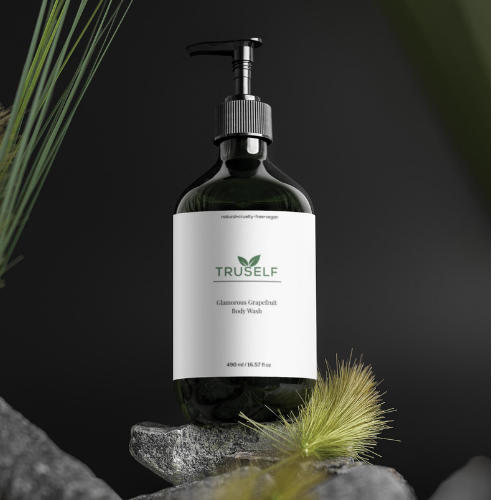Body wash bottle with black pump, dark green bottle, white grapefruit label