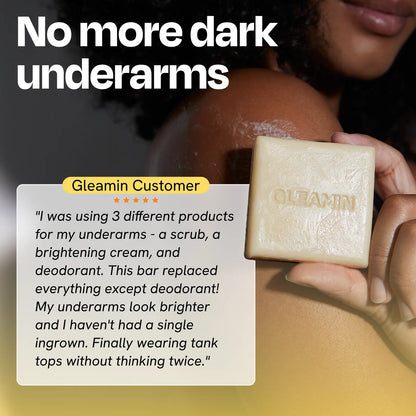 Cleansing bar near underarm, square pale yellow soap with GLEAMIN imprint