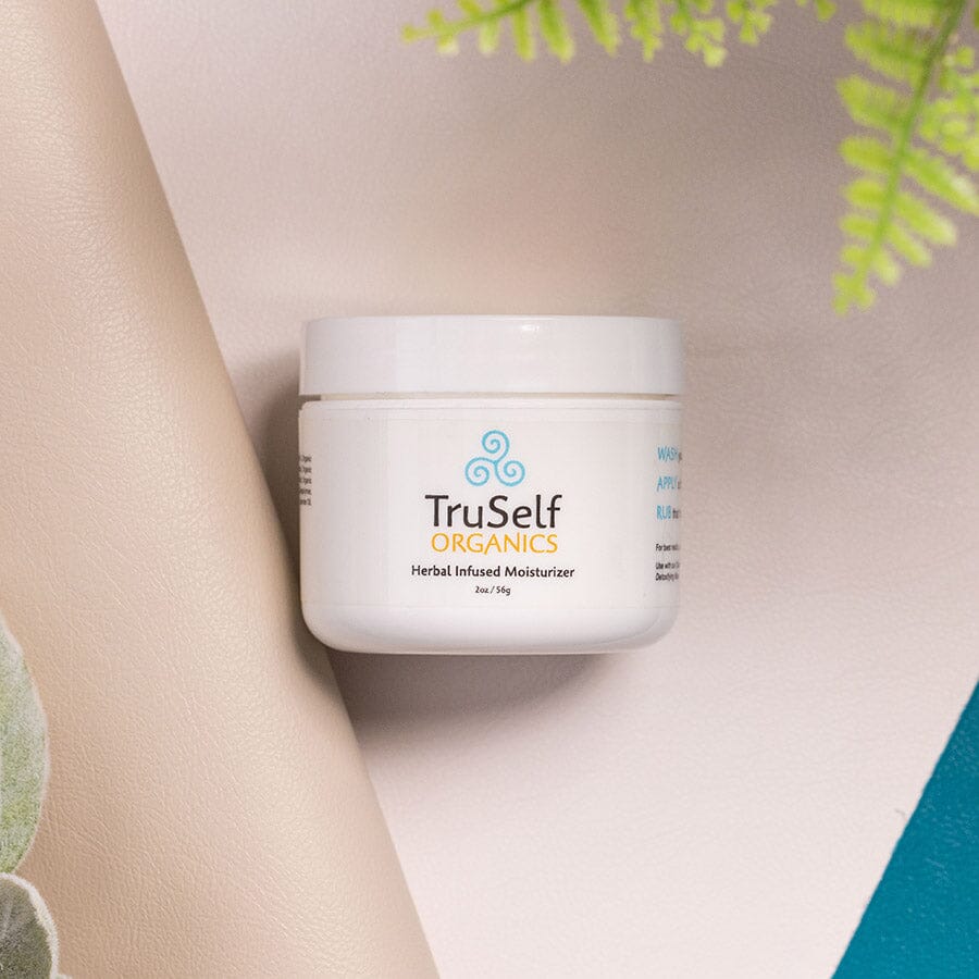 Herbal infused moisturizer jar with white container and TruSelf ORGANICS label
