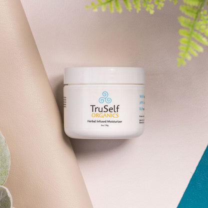 Herbal infused moisturizer jar with white container and TruSelf ORGANICS label