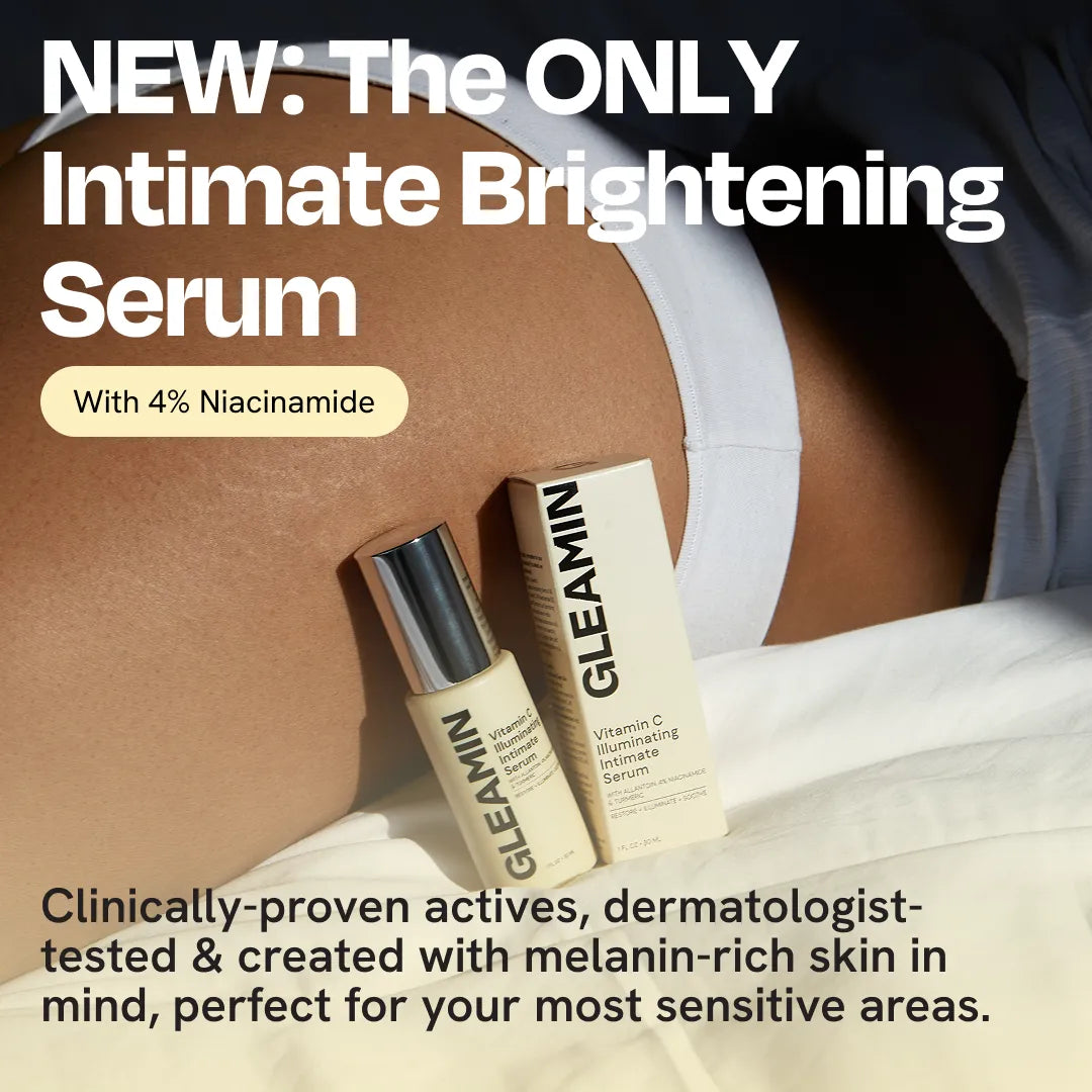 Intimate serum bottles near white underwear on skin, held for application.
