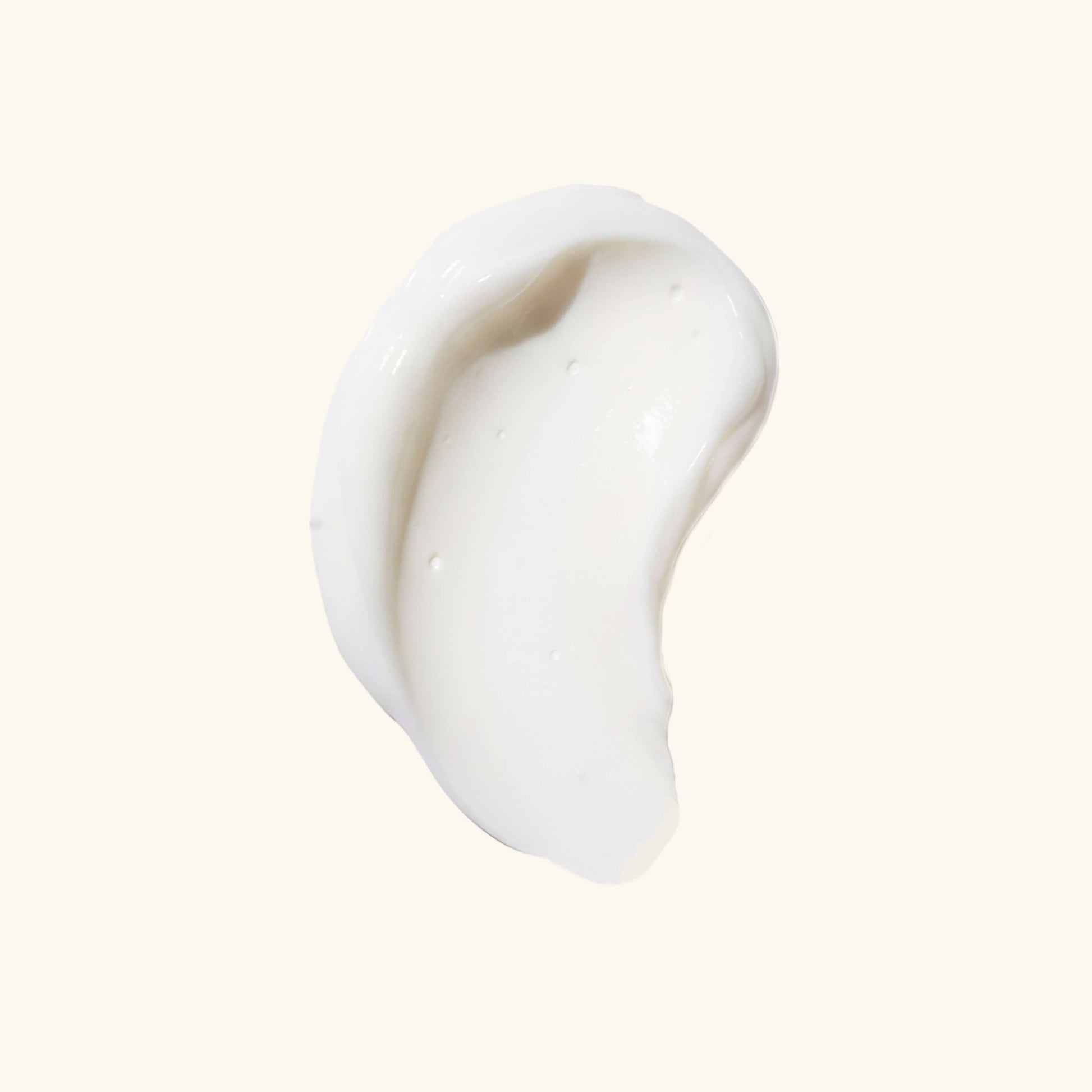 Thick white cream swatch on a plain background.
