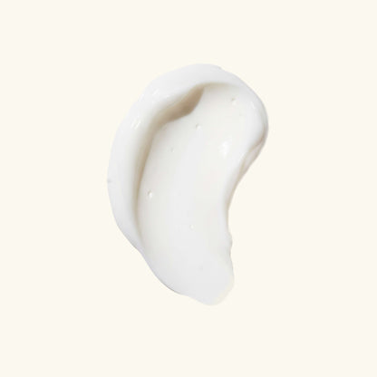 Thick white cream swatch on a plain background.
