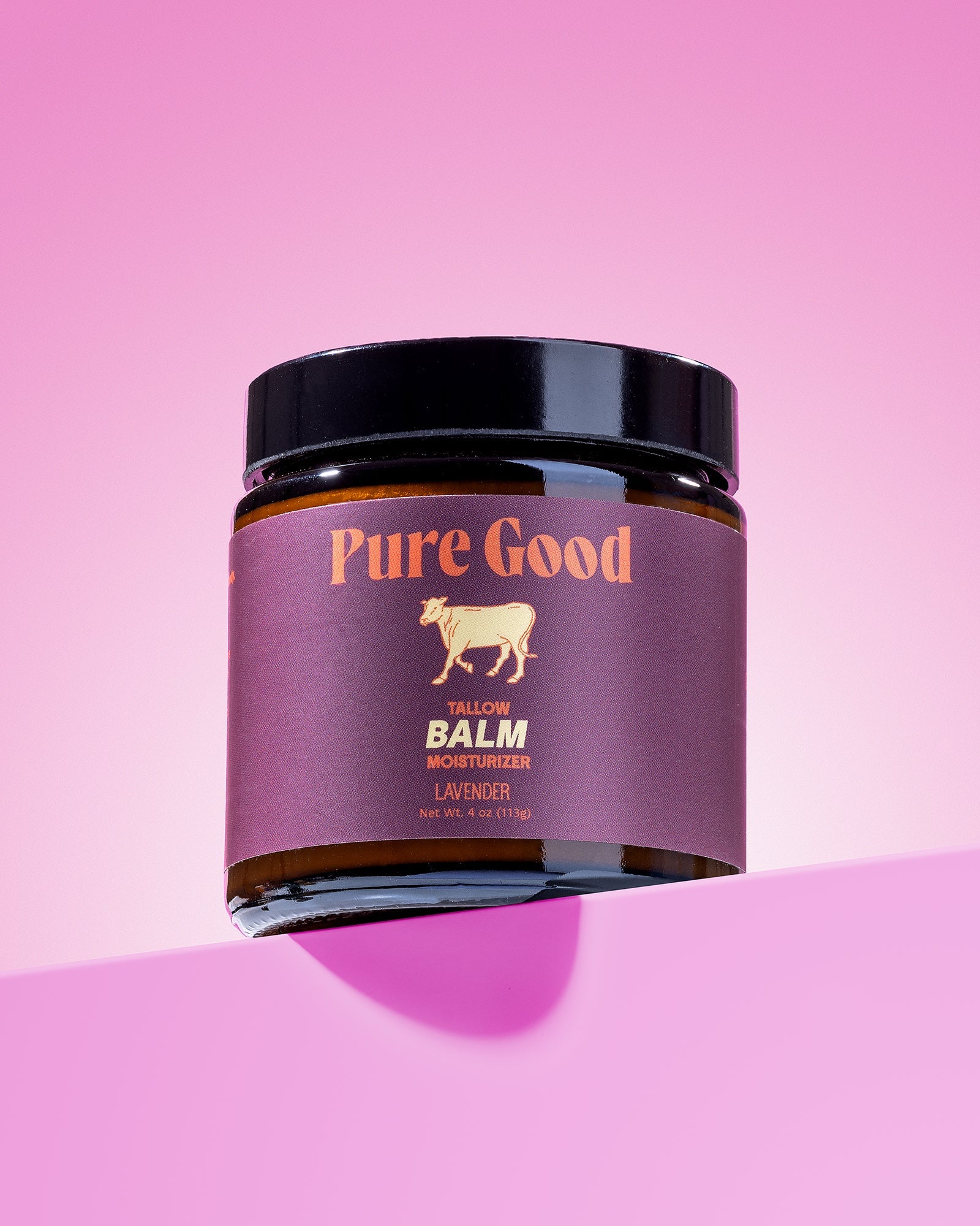 Lavender tallow balm jar with black lid and purple label, front view