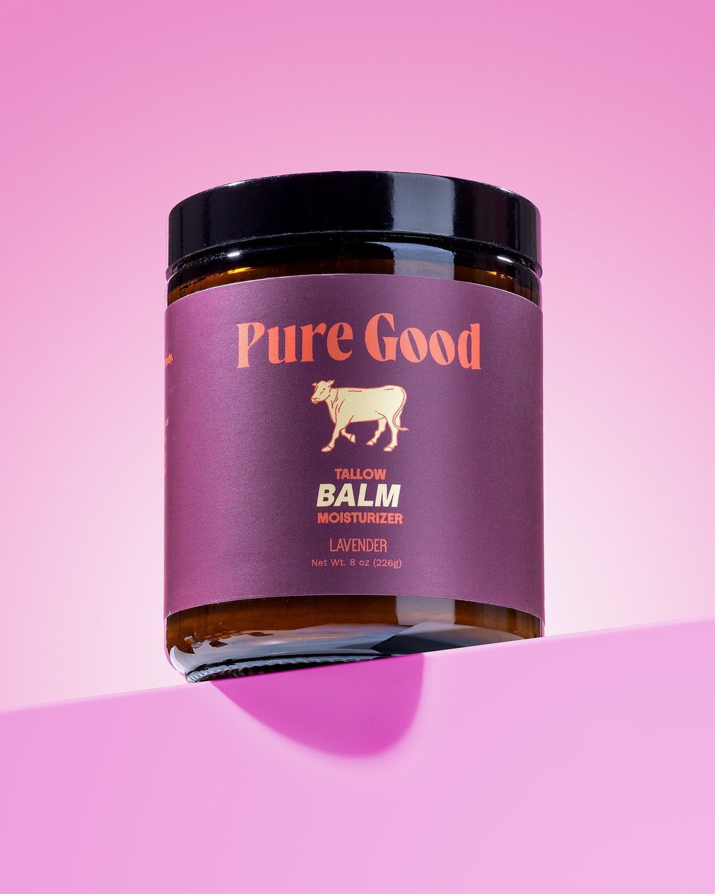 Lavender tallow balm jar with black lid and purple label