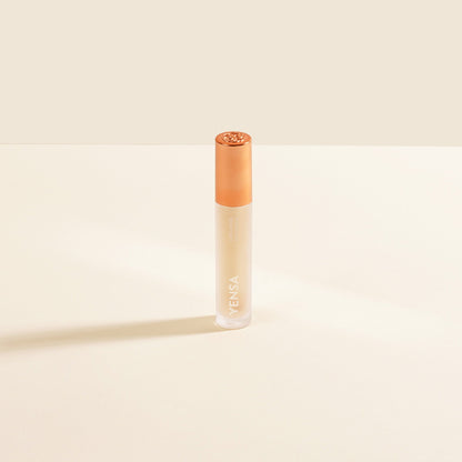 YENSA lip oil bottle with rose-gold cap, clear gel formula