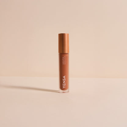 YENSA lip oil bottle with rose-gold cap, warm brown tinted gel