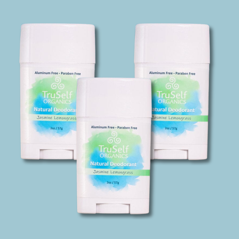 Set of three deodorant sticks in white with Jasmine Lemongrass labels.