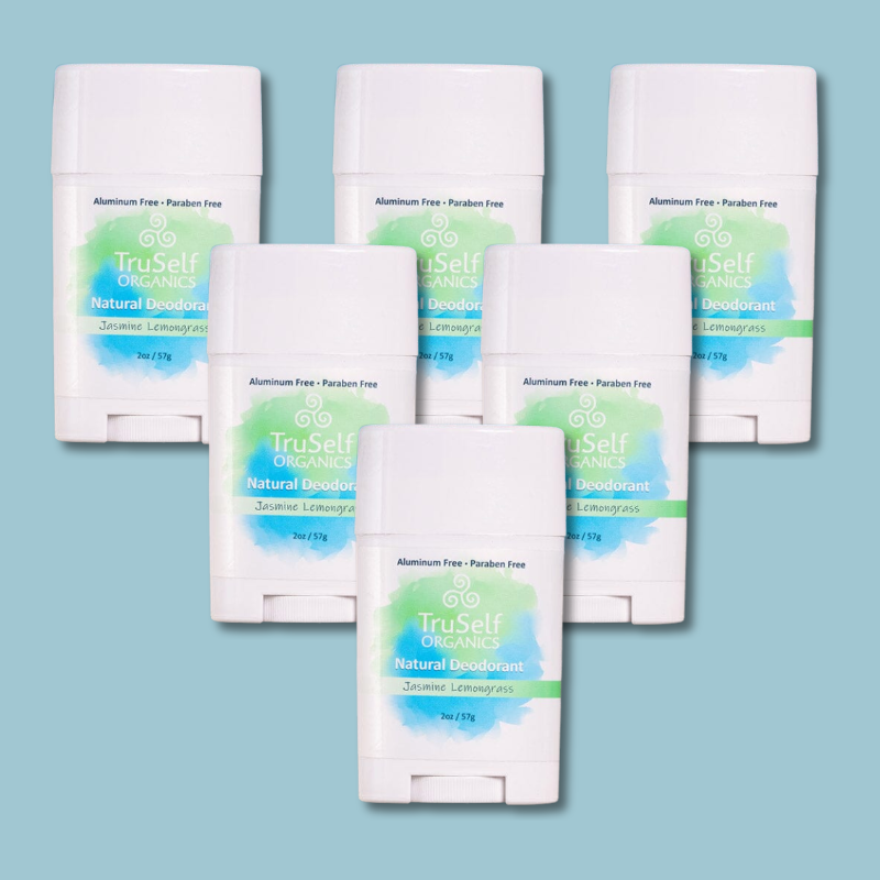 Set of deodorant sticks in white with Jasmine Lemongrass labels, front centered.