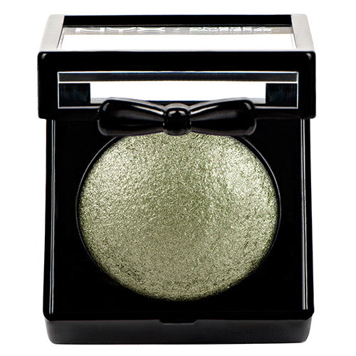 Baked eyeshadow compact with round metallic olive-green pan and clear lid