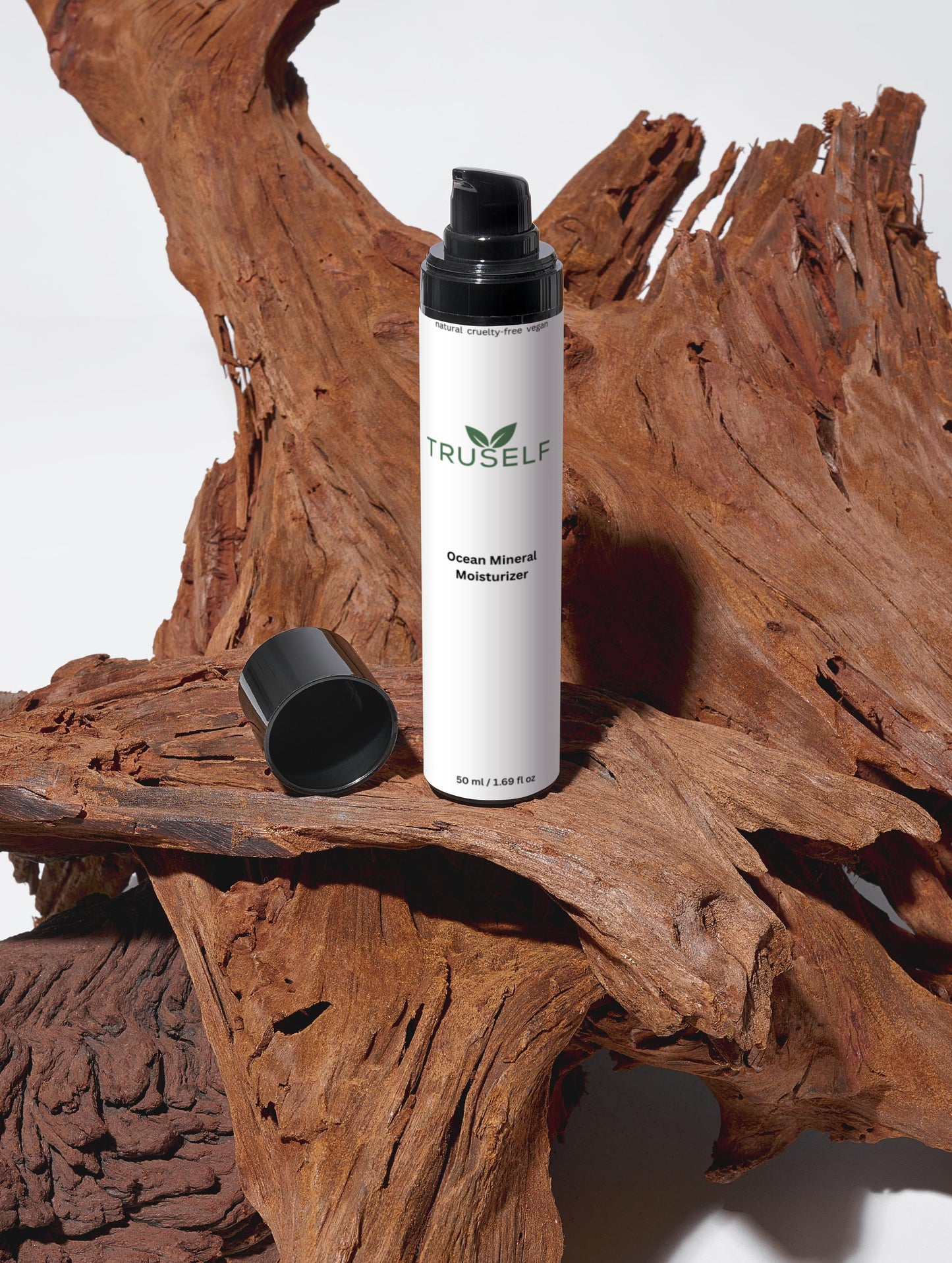 Ocean Mineral Moisturizer bottle with open black cap, TRUSELF branding