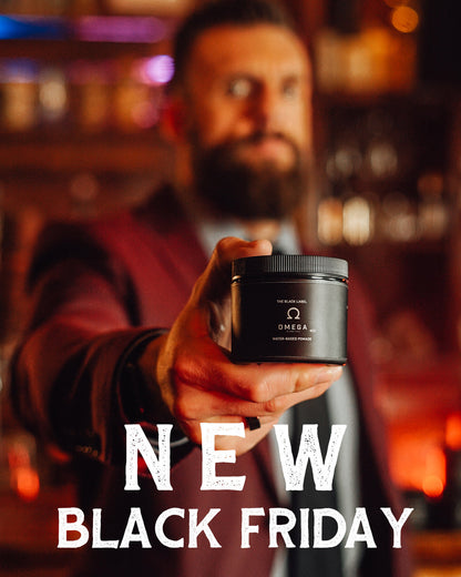 Hand holding water-based pomade jar with black Omega label, 4oz