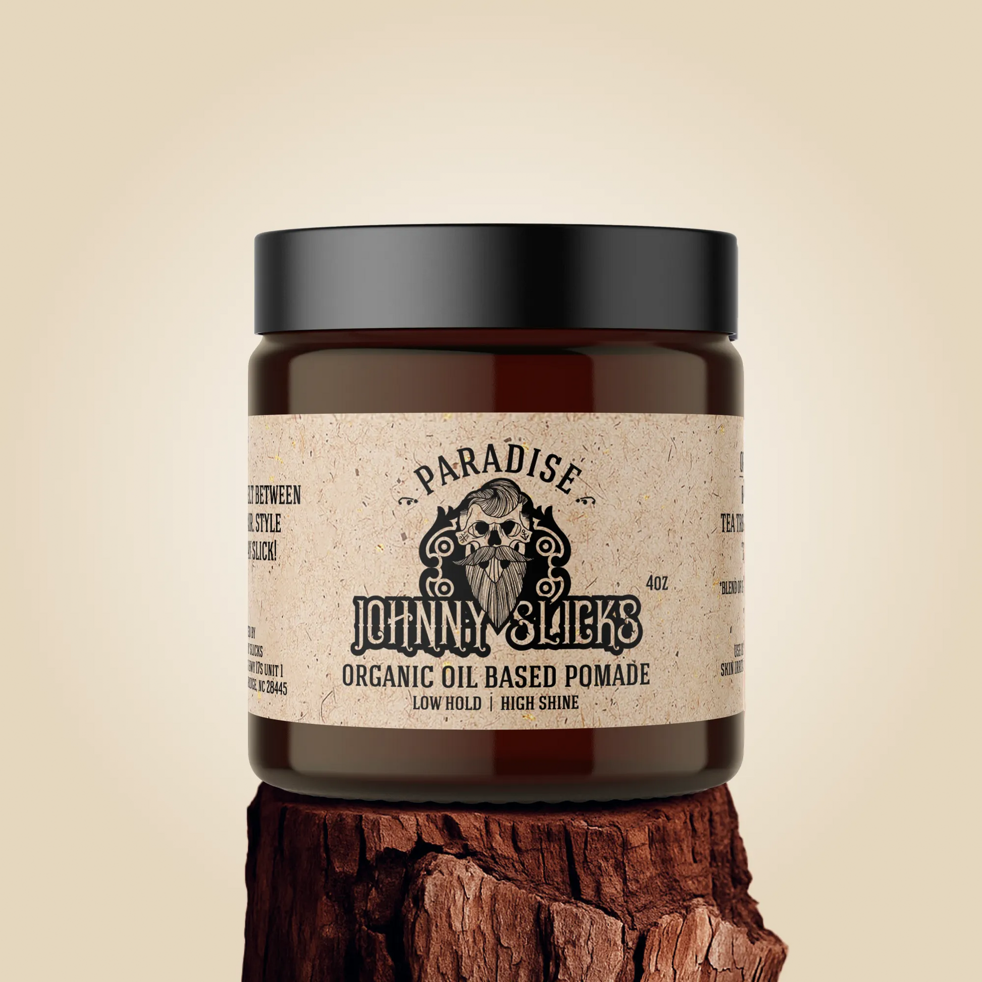 Johnny Slicks organic oil based pomade jar with black lid and brown label