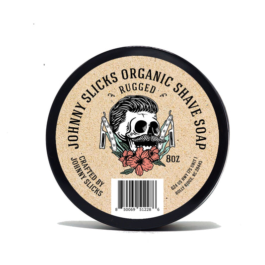 Organic shave soap, black tin with beige label reading Rugged and 8 oz