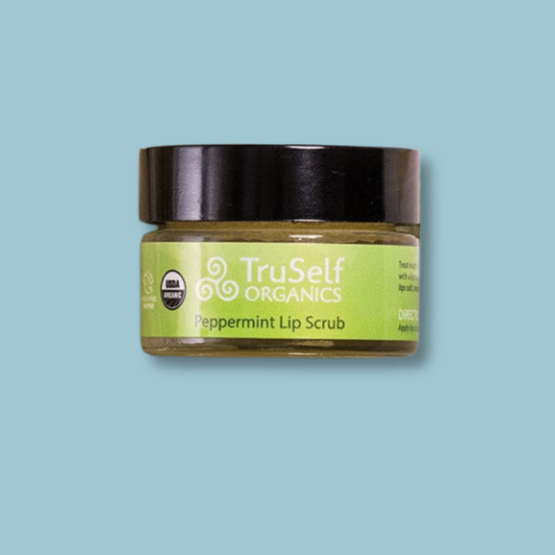 TruSelf ORGANICS peppermint lip scrub jar with black lid and green label.