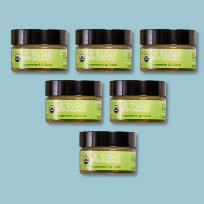 Collection of six TruSelf ORGANICS peppermint lip scrub jars with black lids and green labels.