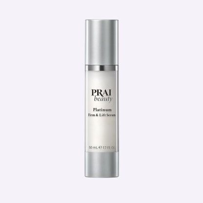 Serum bottle with silver cap and PRAI beauty Platinum Firm & Lift Serum label, 50 mL